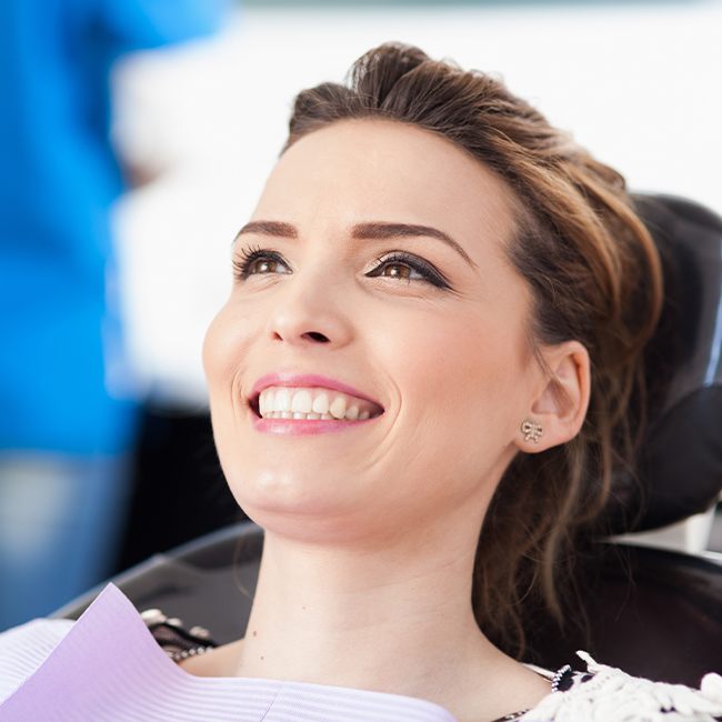 Patient smiling after cosmetic dental bonding